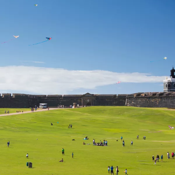 Visitors fly kites on the grounds of El Morro in Old San Juan.