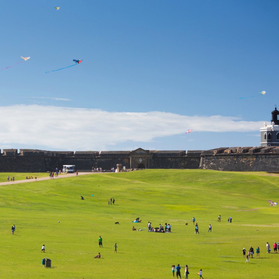 Visitors fly kites on the grounds of El Morro in Old San Juan.