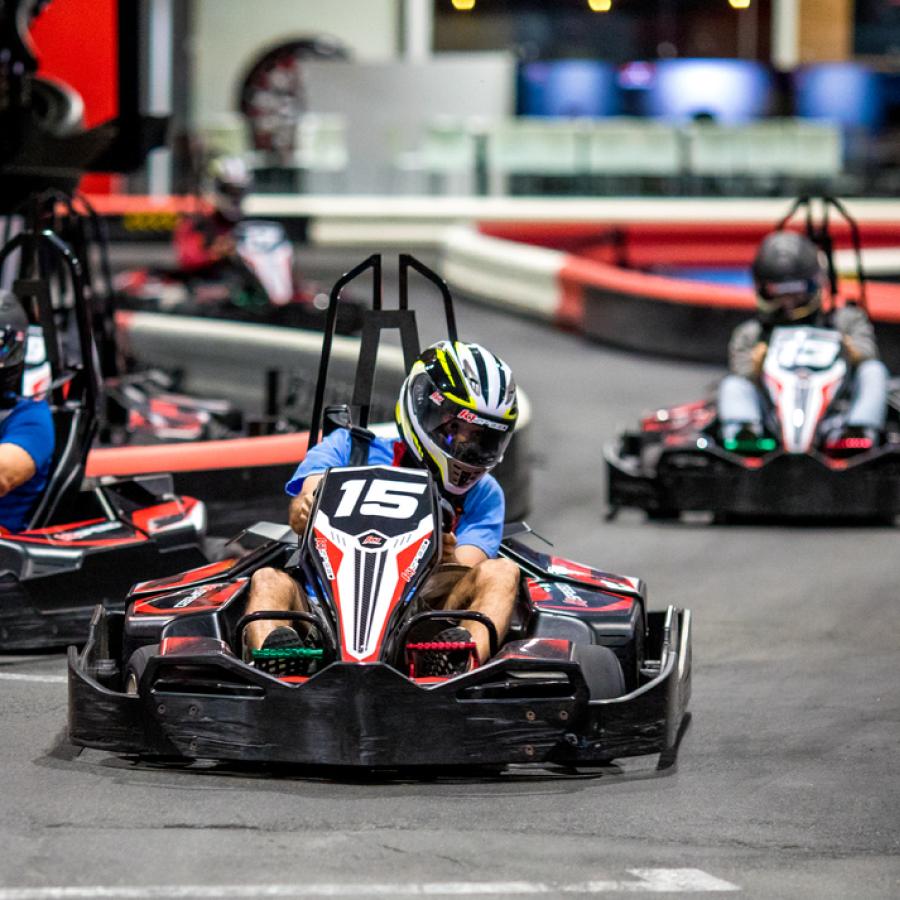 A group races go-karts at Route 66 Mall.