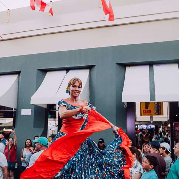 Woman dances bomba at the San Sebastian Street
