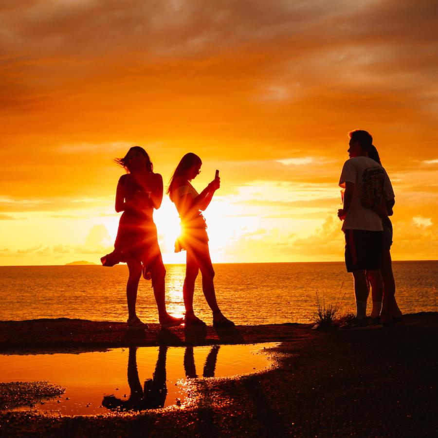Friends enjoy a beautiful sunset in Aguadilla