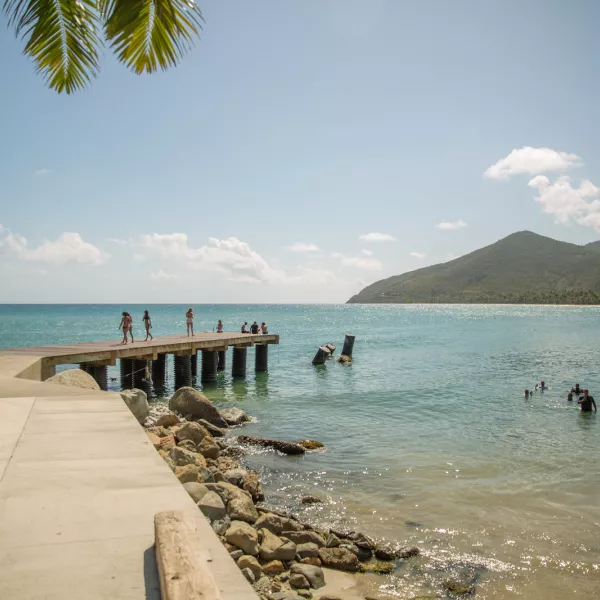 Beach goers enjoy the beautiful waters off Maunabo.