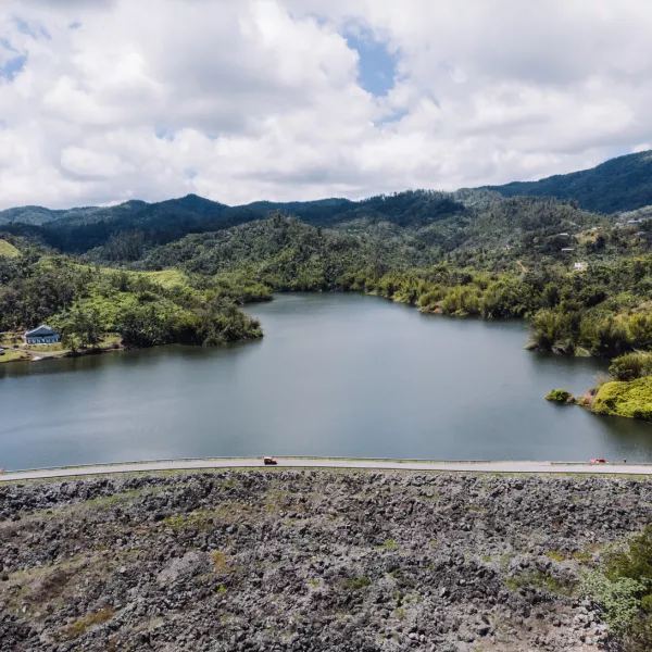 Lago Garzas in Adjuntas with mountains in the background