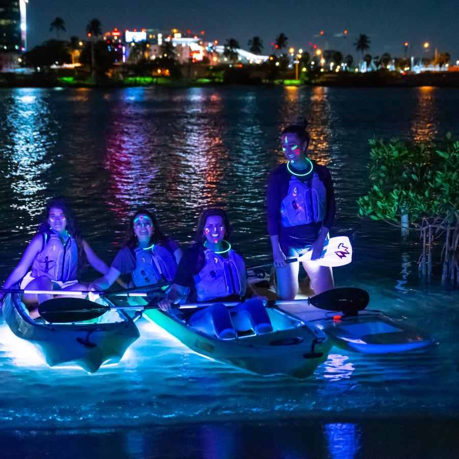 A group kayaks through the Condado Lagoon. 