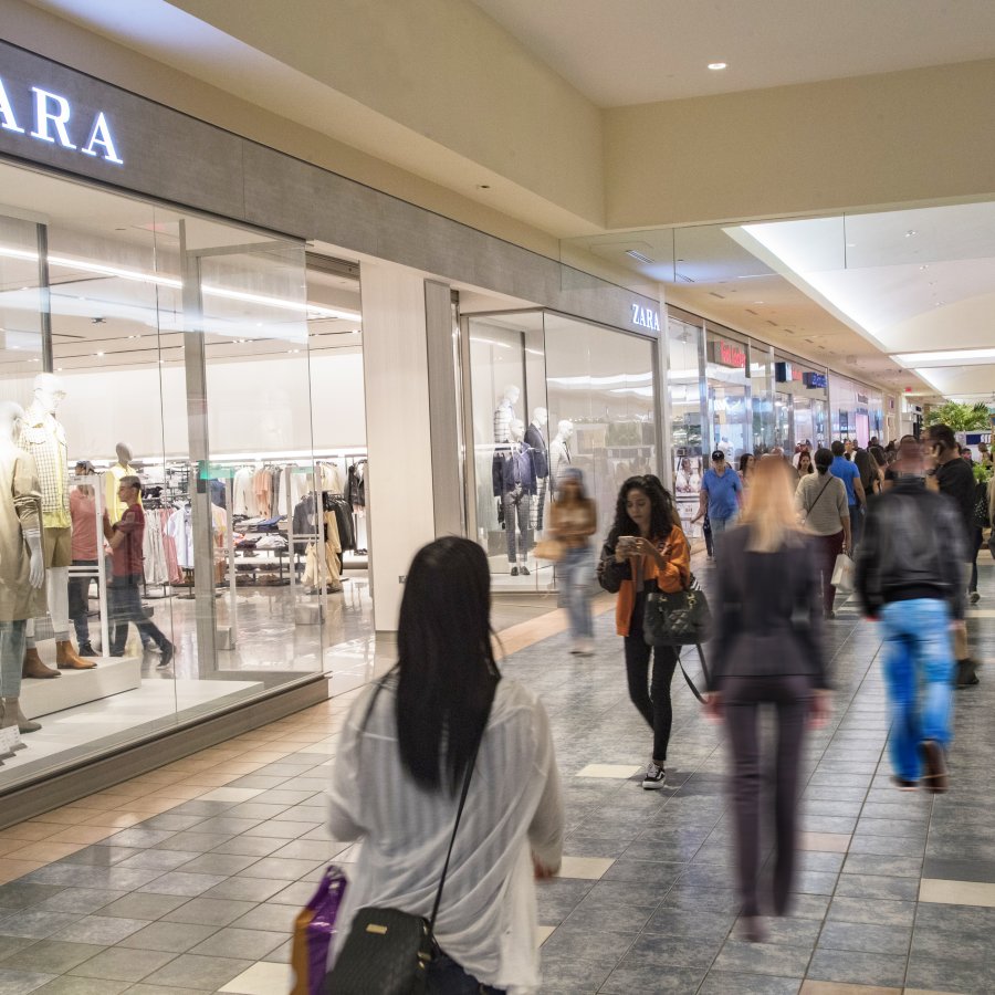 People shop around Plaza Las Américas