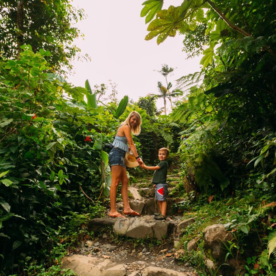 Mother and kid walking through one of El Yunque's trails.