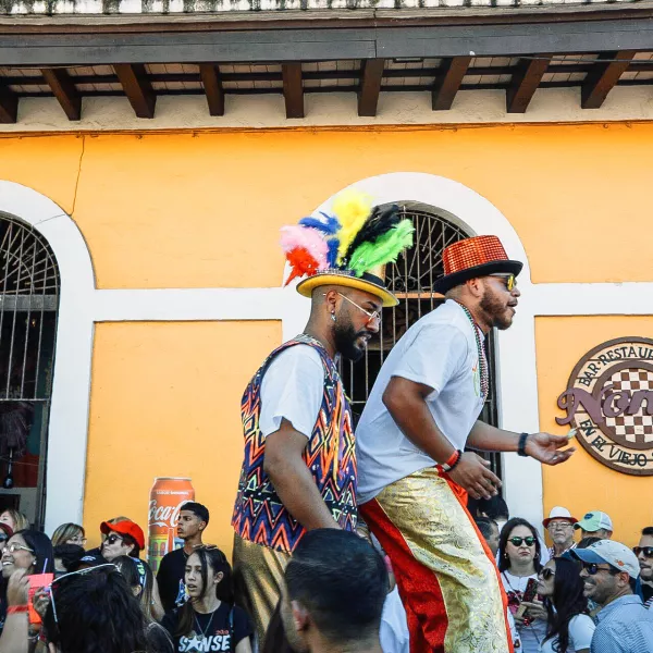 People celebrating Fiestas de la Calle San Sebastián in Old San Juan, part of the vibrant Christmas celebrations in Puerto Rico.
