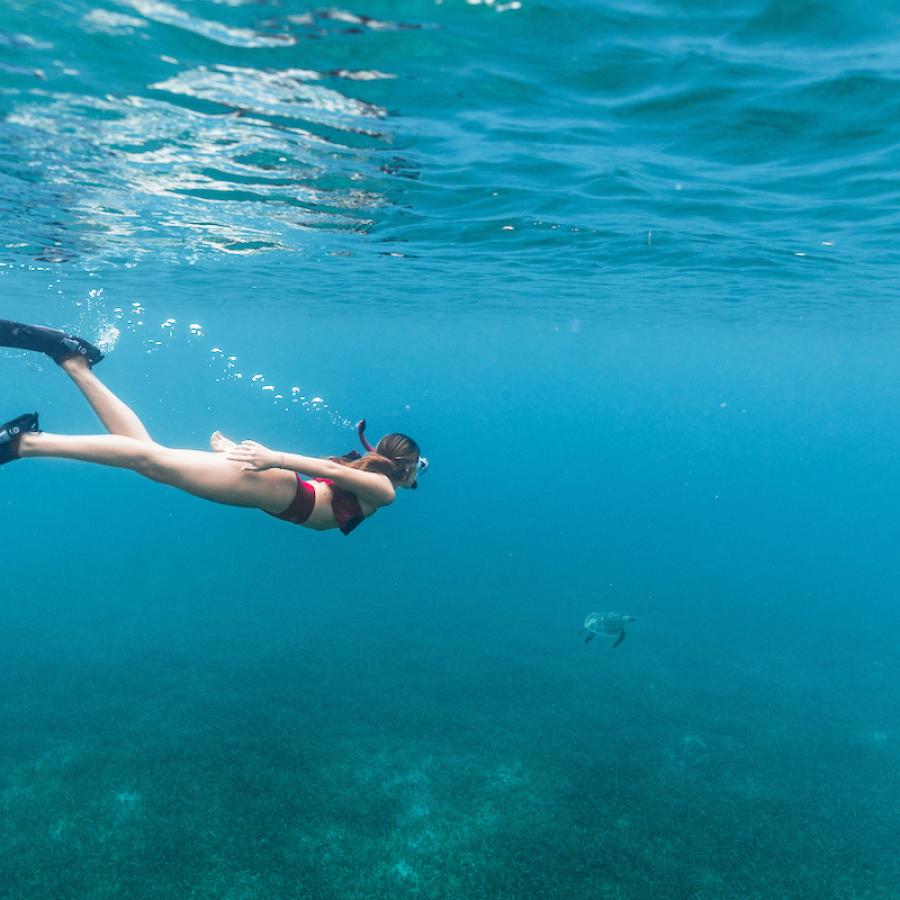 A girl snorkles in Culebra