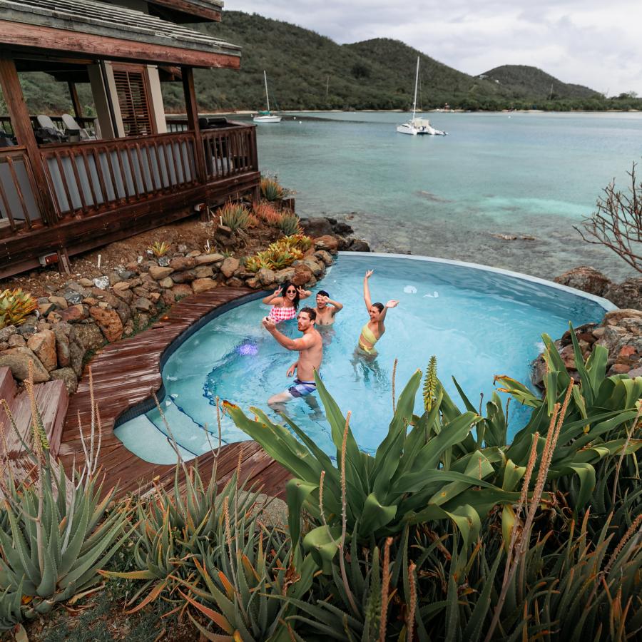 Three friends enjoying their ocean front pool at a private villa rental in Culebra.