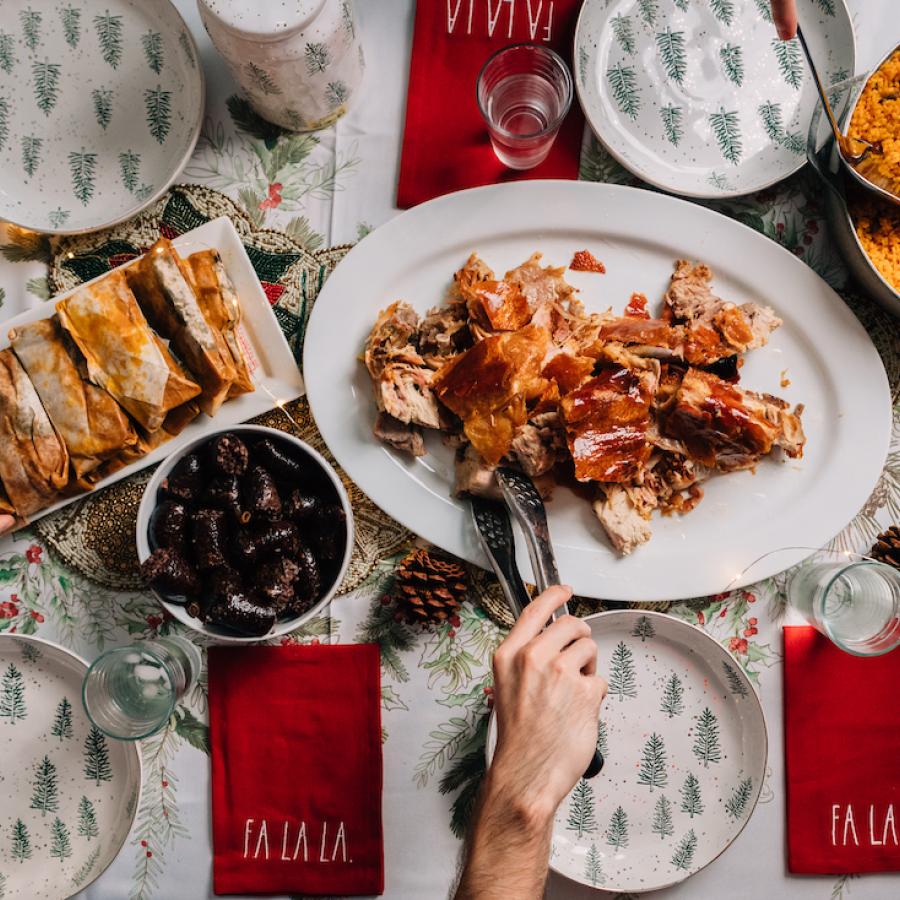 The holiday menu in Puerto Rico includes local favorites like pernil, arroz con gandules, pasteles, tembleque, and arroz con dulce. 