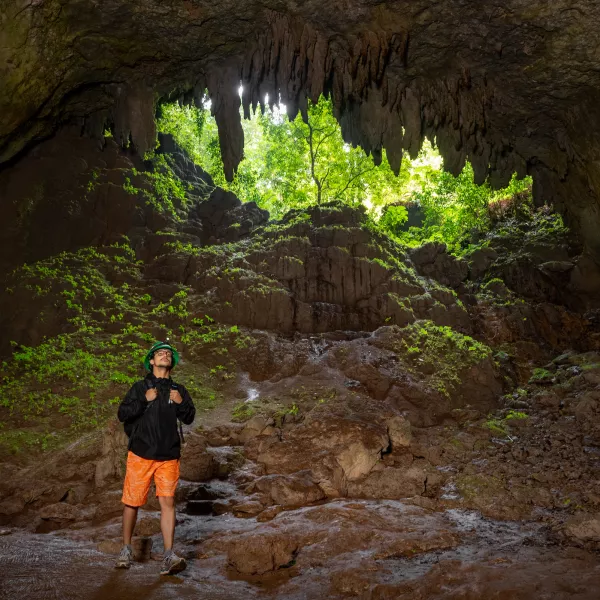 Hiker exploring Río Camuy Cave Park during a 3-day adventure in Puerto Rico