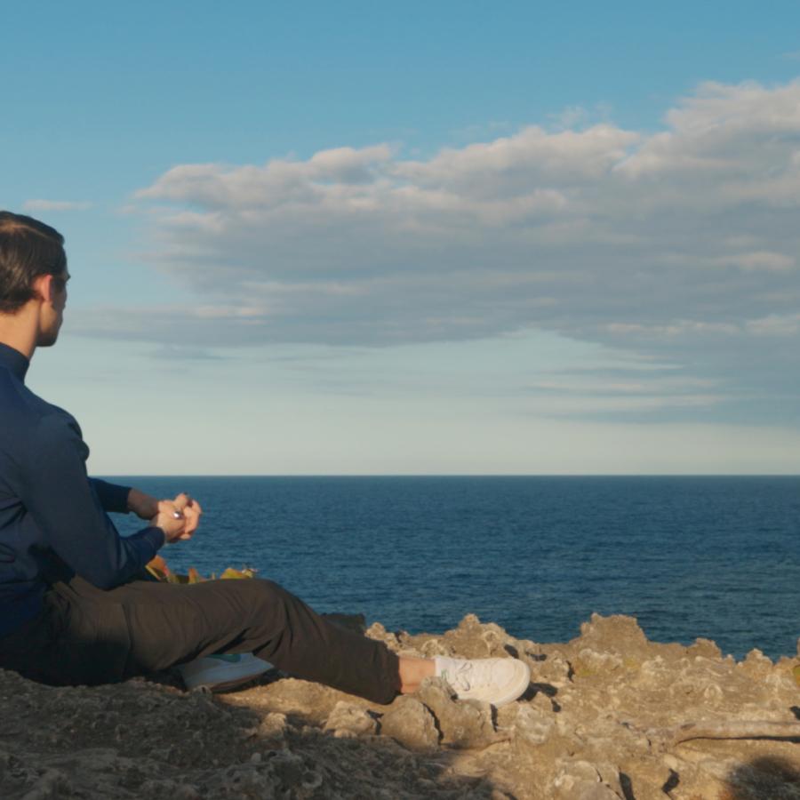 Christian Cowan looks out onto a beach in Puerto Rico.