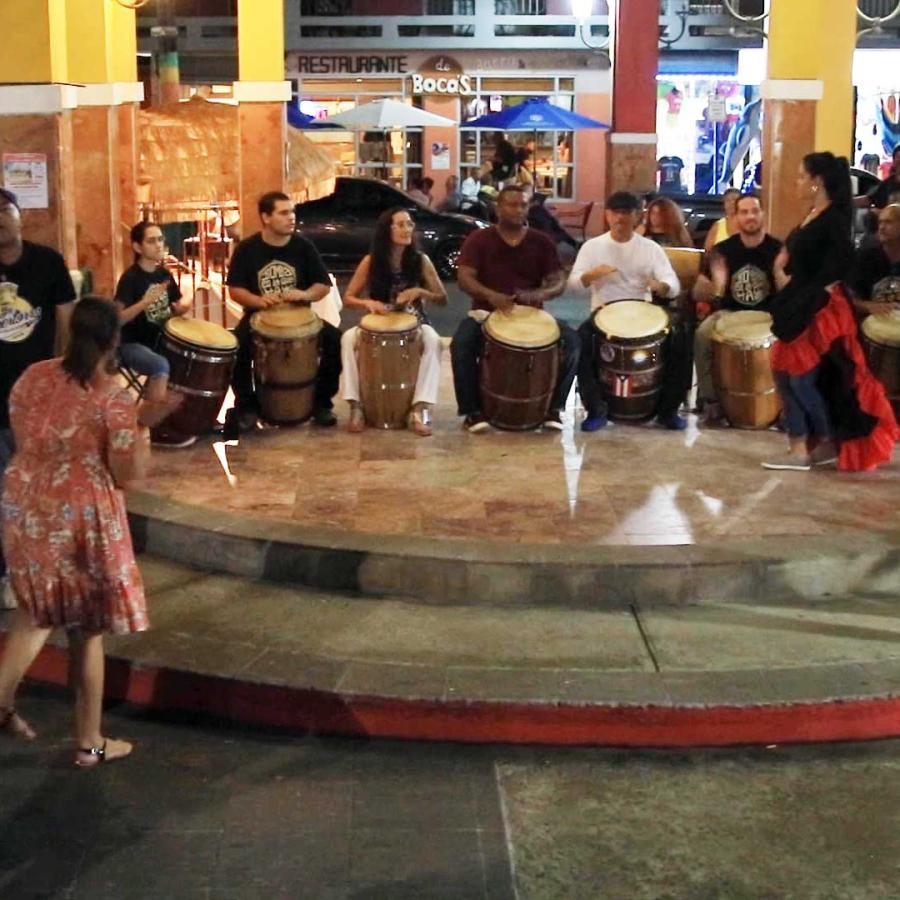 People dance bomba at the Rincon Art Walk. 
