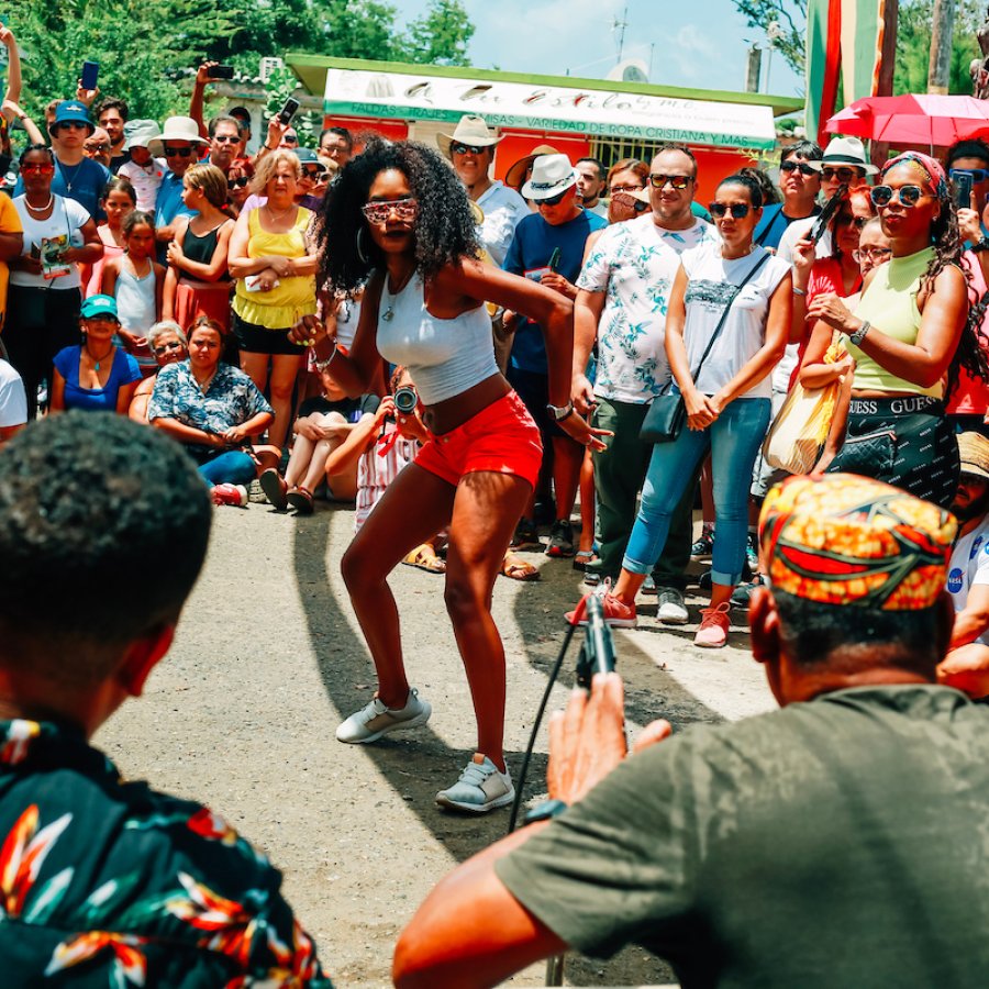 A woman dances bomba at the Hermanos Ayala batey.