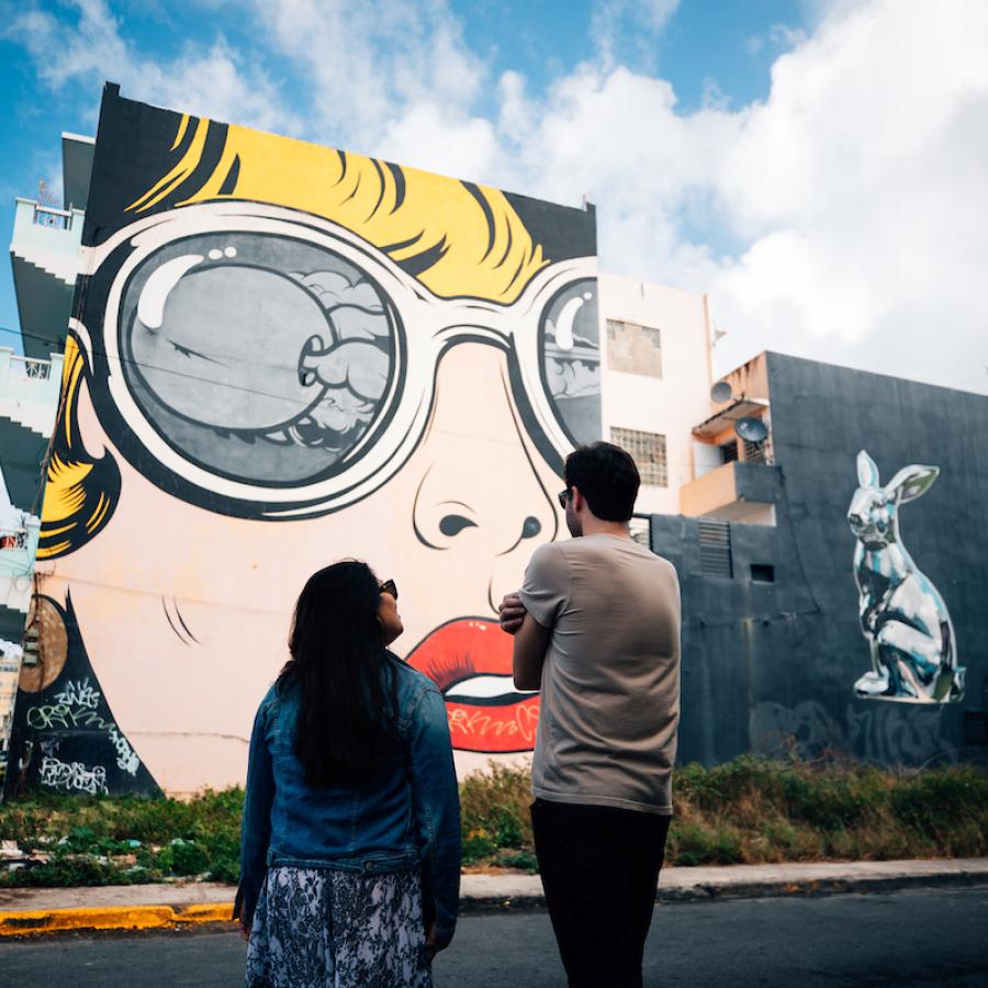 Couple admiring street art in Santurce