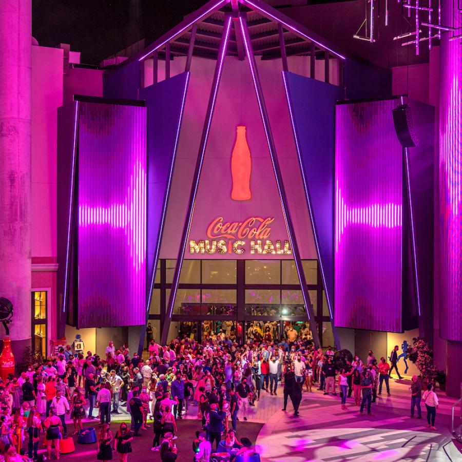 A crowd gathers outside Coca-Cola Music Hall at Distrito T-Mobile