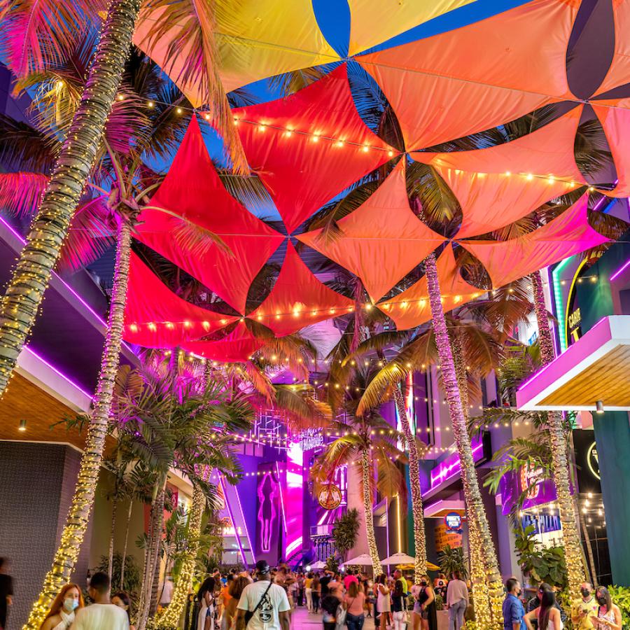 A colorful art installation hangs overhead at Distrito T-Mobile