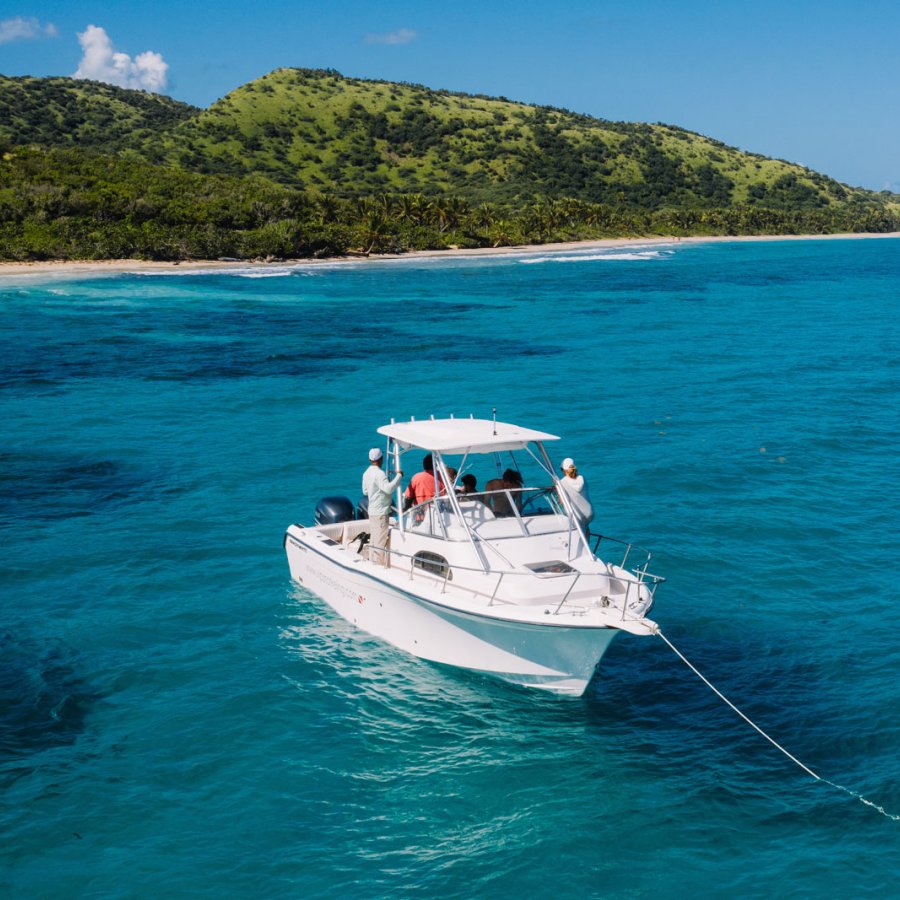 A boat anchored off a beautiful beach in Puerto Rico