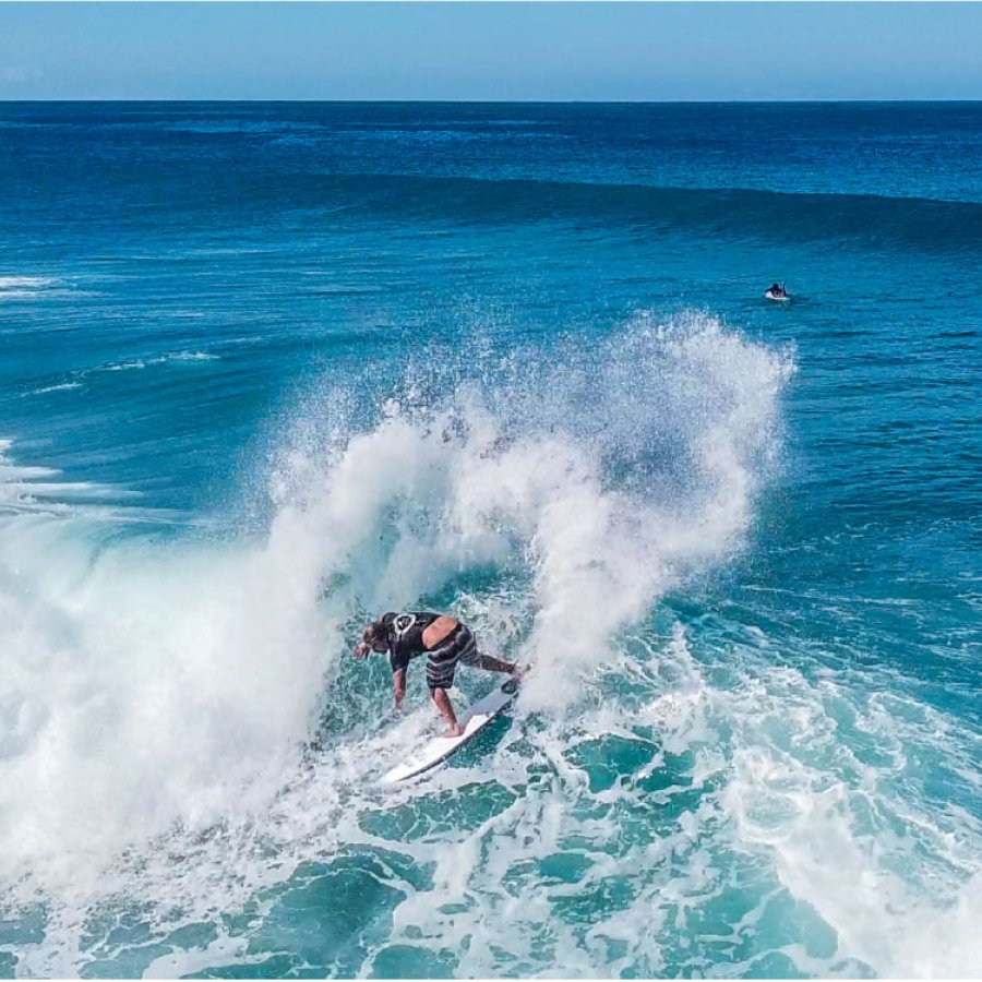 A surfer rides a wave in Rincon.