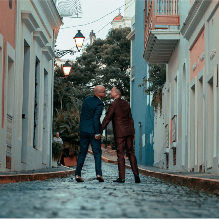A gay couple kisses in the streets of Old San Juan in Puerto Rico.