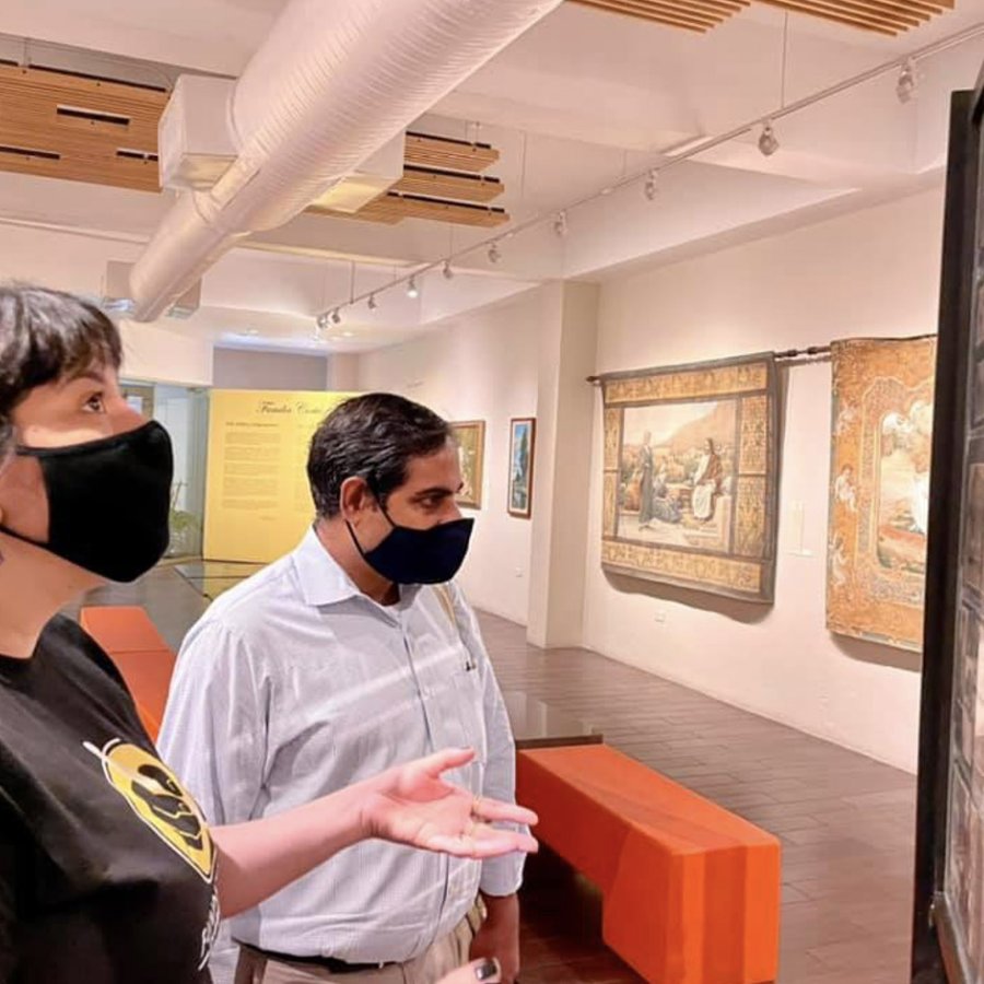 Two people wearing masks tour the Cortes Art Gallery in Old San Juan, Puerto Rico.