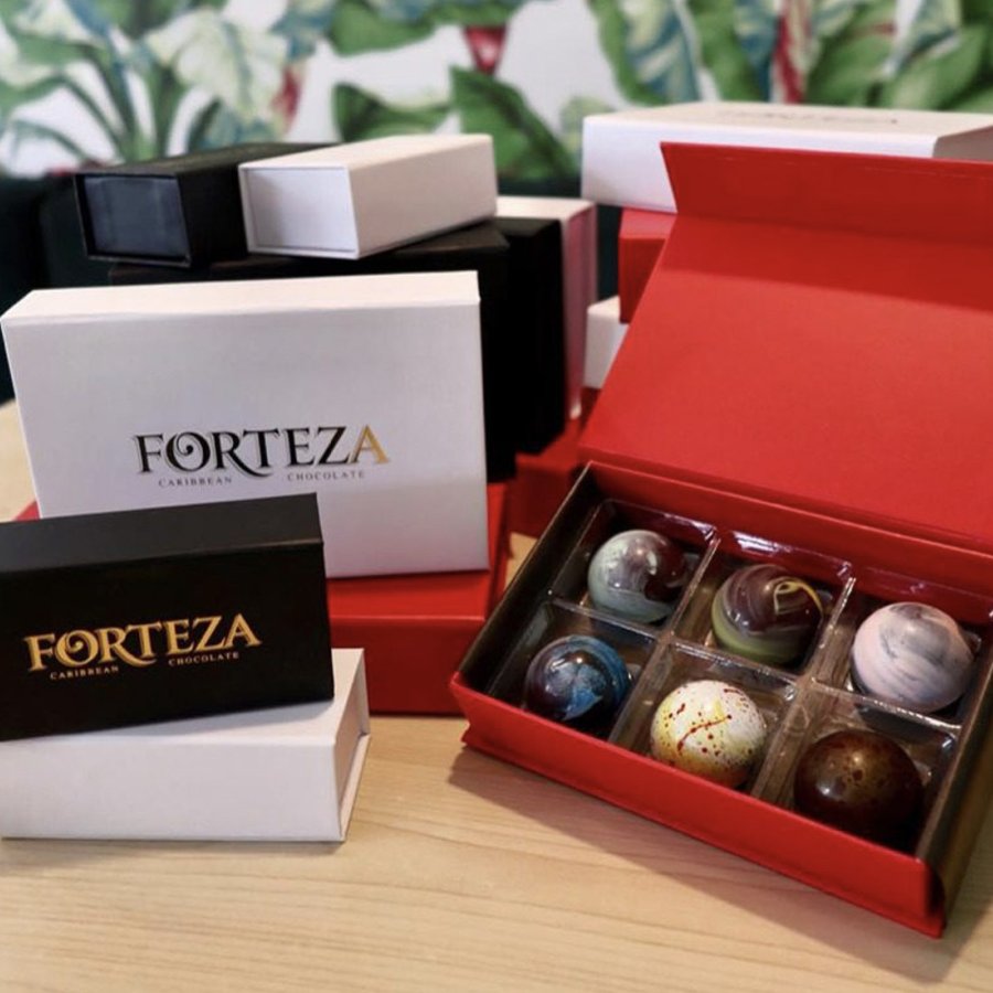 Boxes of decorative chocolate bonbons from Cortés are displayed in boxes branded "Forteza."