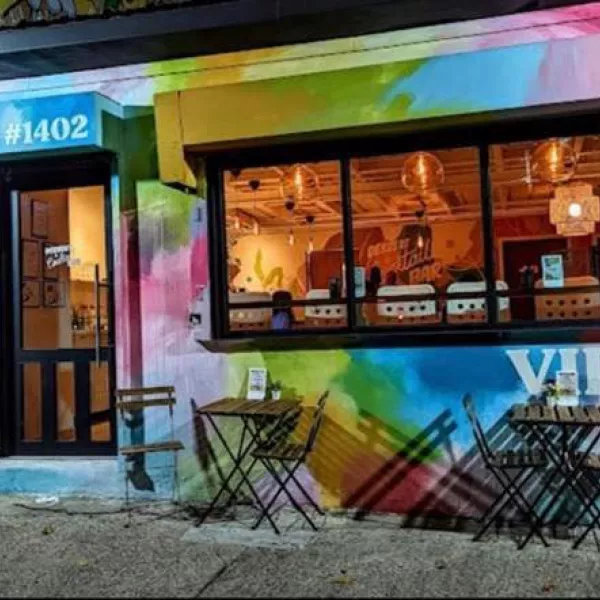 Exterior of VIDA by Yara chocolate shop in Santurce, San Juan, which is painted in a variety of bright colors.