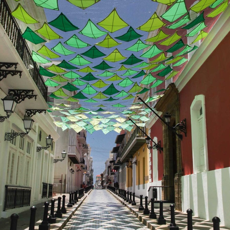 Colorful kites strung above Fortaleza Street. Taking pictures at this spot is one of the best things to do in Old San Juan.