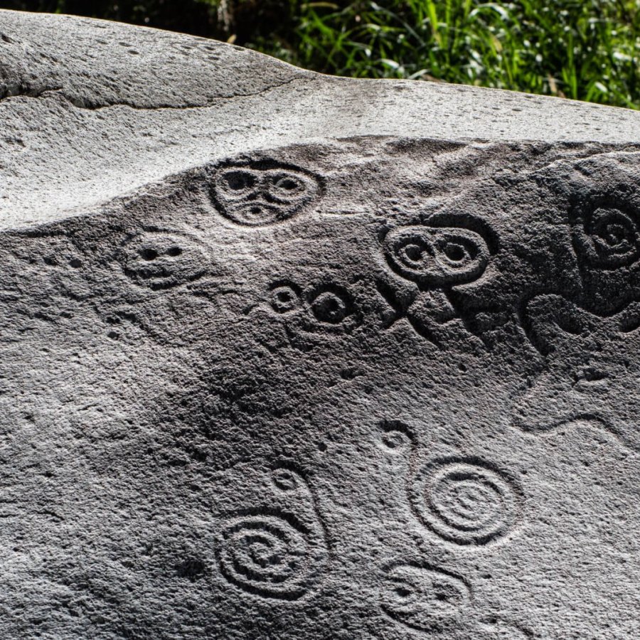 Ancient petroglyphs are pictured on a large rock at Piedra Escrita in Jayuya, Puerto Rico.