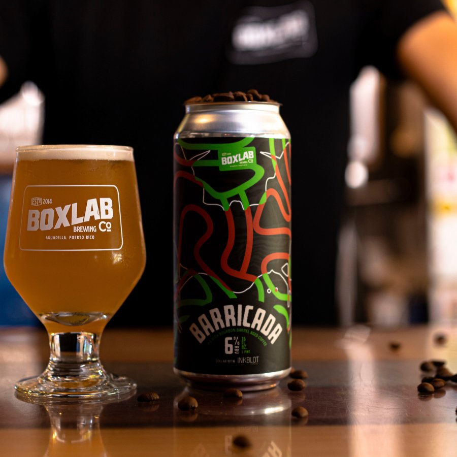 A glass of beer and can of Box Lab Beer