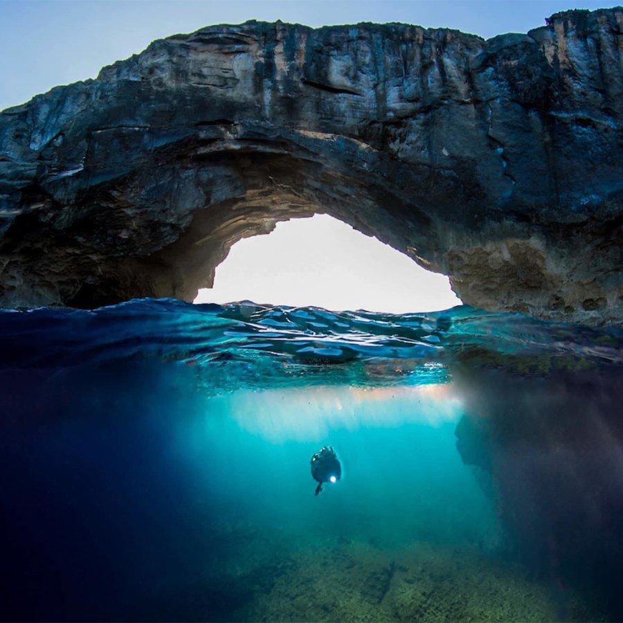 A scuba diver exploring the Cueva del Indio in Puerto Rico.