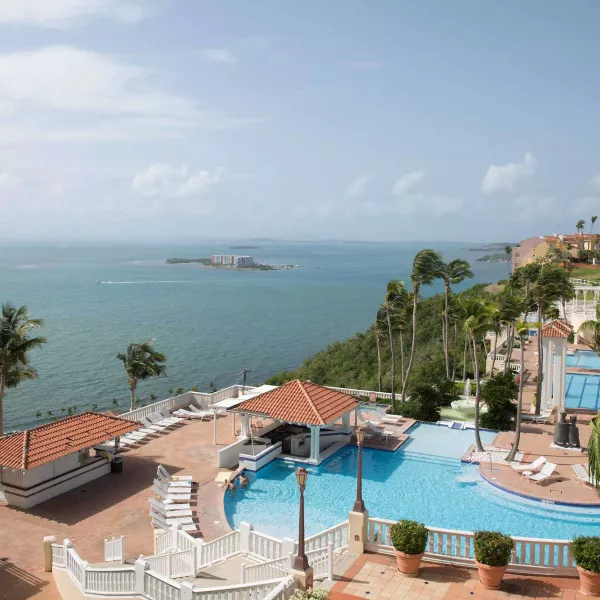 Wide view of El Conquistador Resort, which sits on a hillside and overlooks the ocean in Fajardo, Puerto Rico.