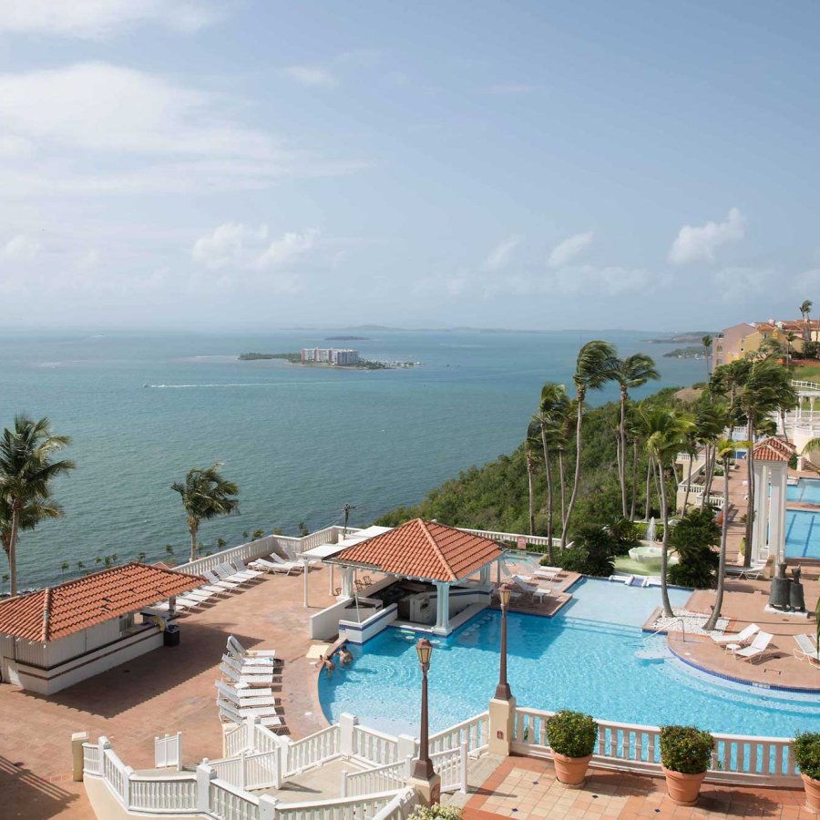 Wide view of El Conquistador Resort, which sits on a hillside and overlooks the ocean in Fajardo, Puerto Rico.