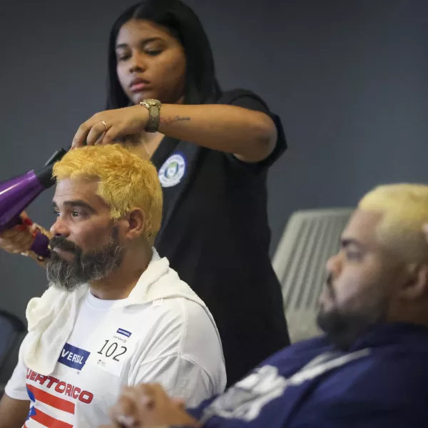 Puerto Rican baseball fans with dyed blonde hair supporting Team Rubio