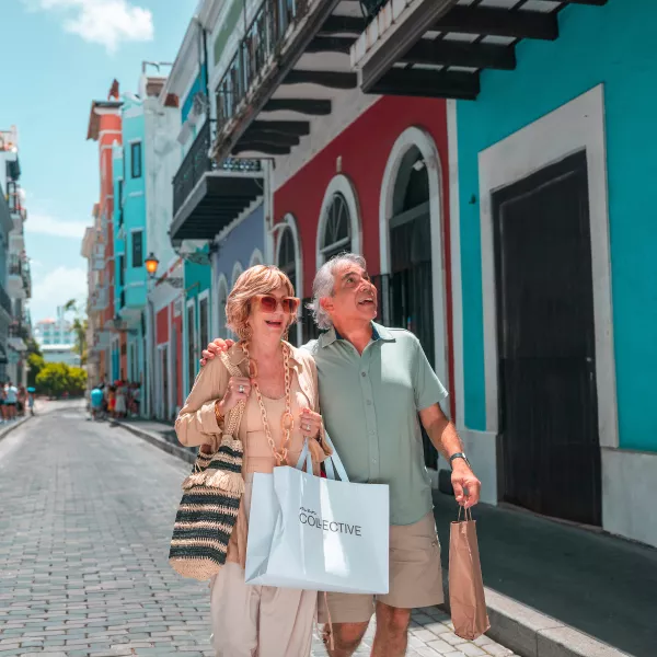 Couple browsing local shops near the San Juan cruise port.