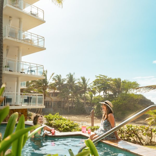 Two women at pool.