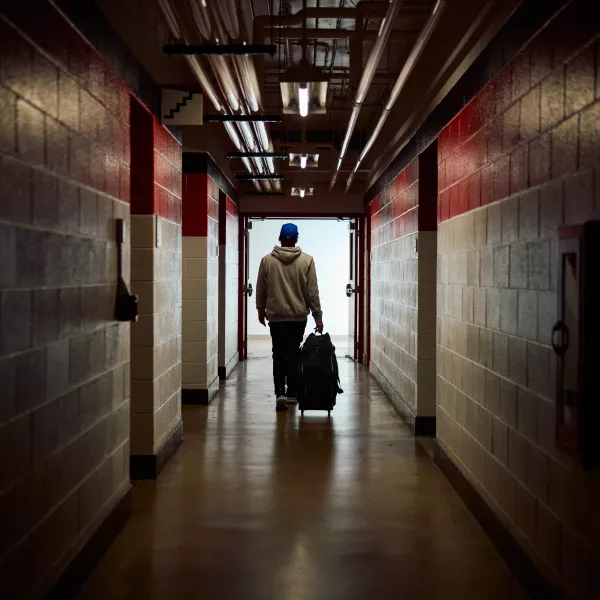 Kike Hernandez exits the locker room at a baseball stadium