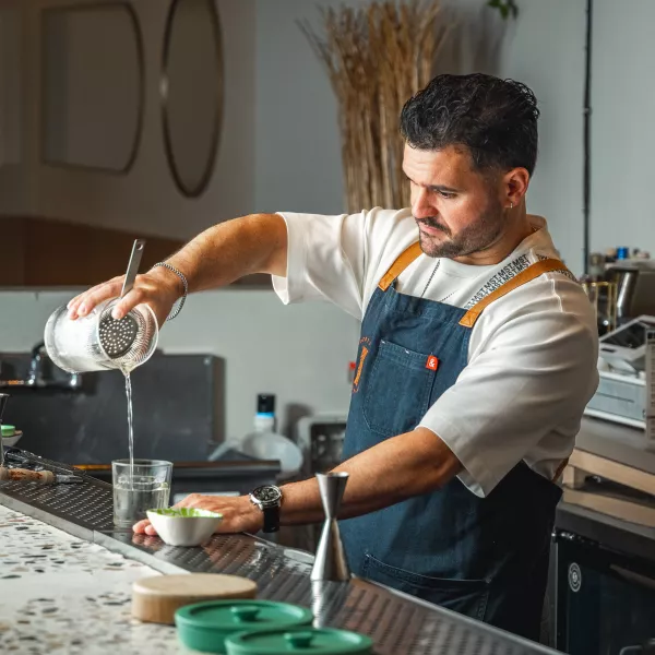 Mixologist Stephen Alonso mixing a cocktail.