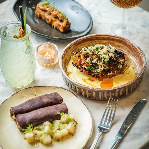 Seasonal dishes and cocktails at Vianda restaurant in Santurce, San Juan, showcasing Puerto Rican ingredients.