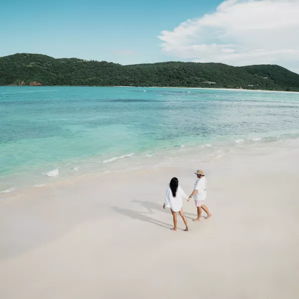 Couple walking in Flamenco Beach.