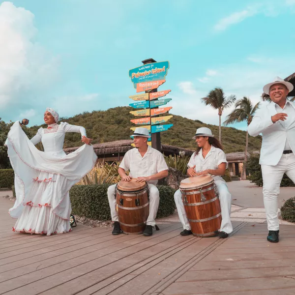 Puerto Rican dances often feature coordinated outfits and lots of colors.