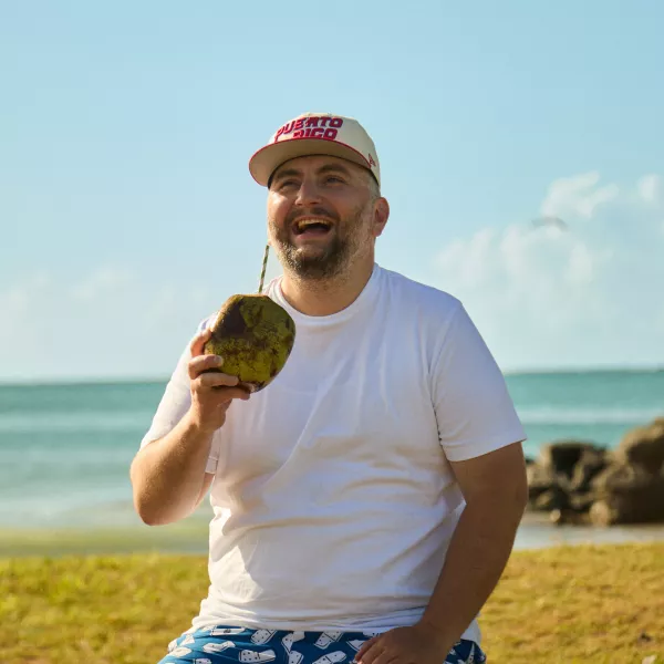 Saxboy Billy drinking coconut water