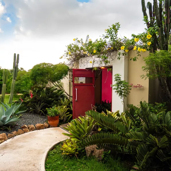 The entrance to 4 Casitas, a sustainable bed-and-breakfast surrounded by native plants and cacti in Cabo Rojo, Puerto Rico.