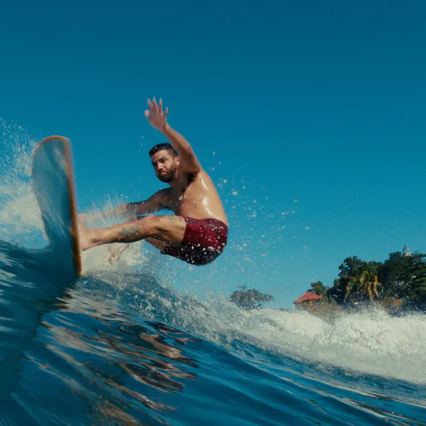 A surfer riding a wave at Maria’s Beach in Rincón, Puerto Rico.