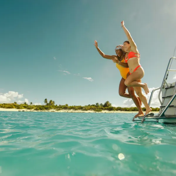 Catamaran excursion guests enjoying the crystal-clear waters of Cayo Icacos near Puerto Rico's east coast.