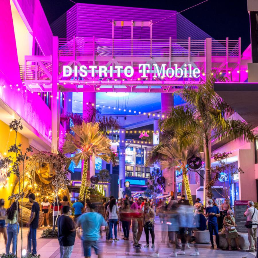 People gather at the atrium in Distrito T-Mobile