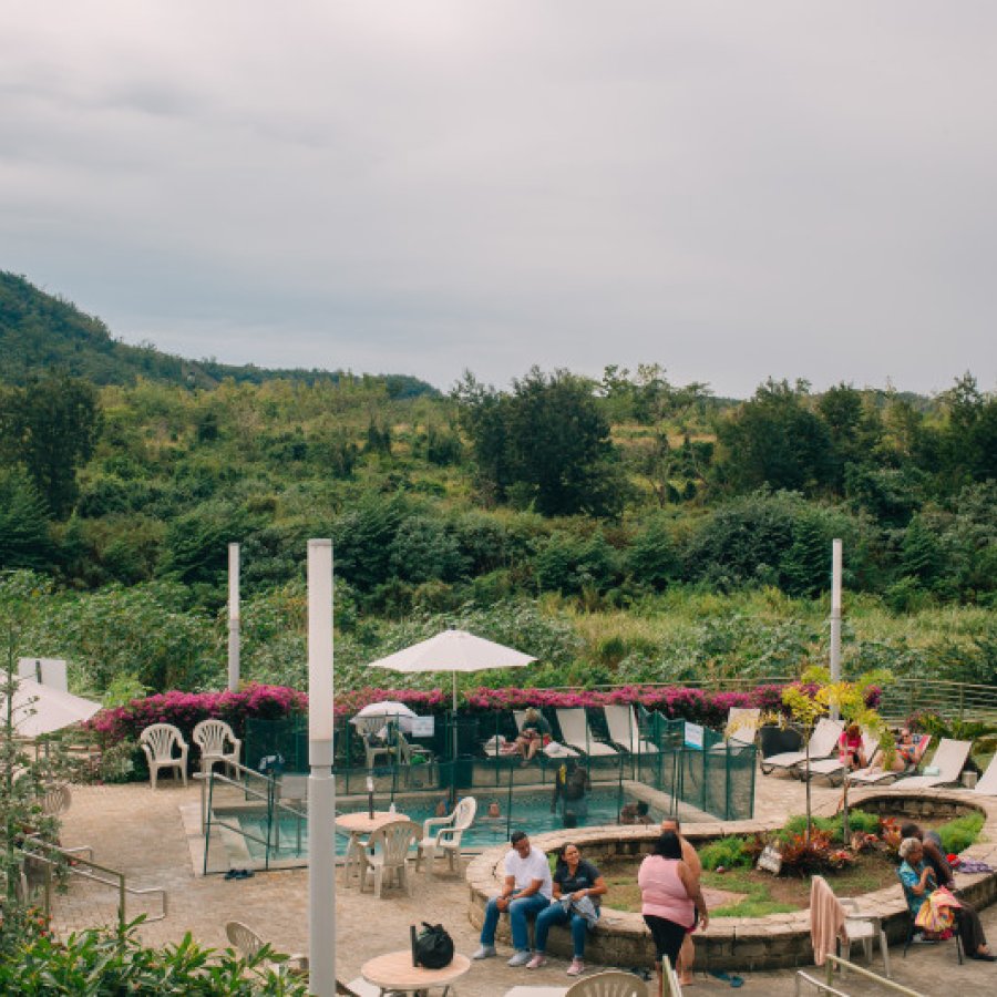 Coamo Hot Springs filled with people.