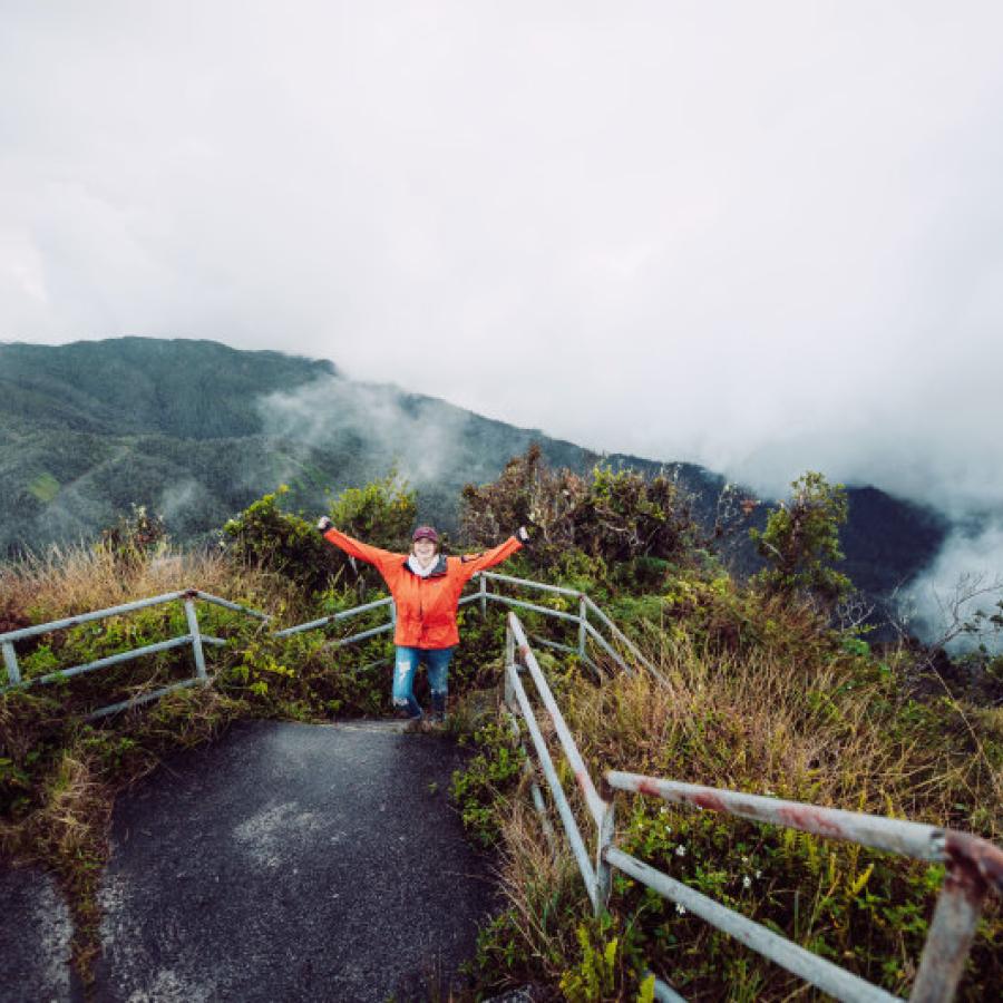 A person hikes up the mountain of the Toro Negro State Forest