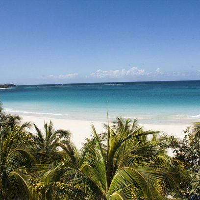 Panoramic view of Flamenco Beach in Culebra, Puerto Rico, known for its white sands and crystal-clear waters.