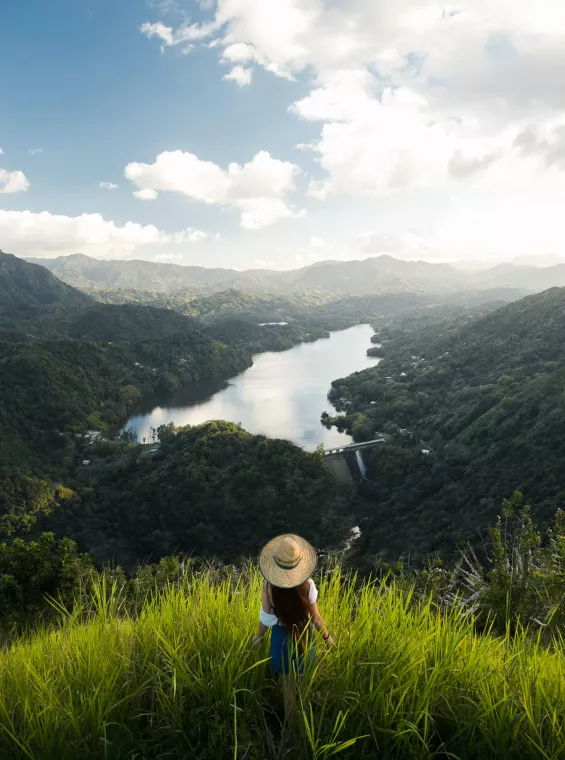 Woman admiring panoramic views of Puerto Rico’s mountains and forests